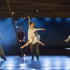 Keith Higham as Billy Bigelow (red shirt) and Alex Newton as Louise (centre) with dancers